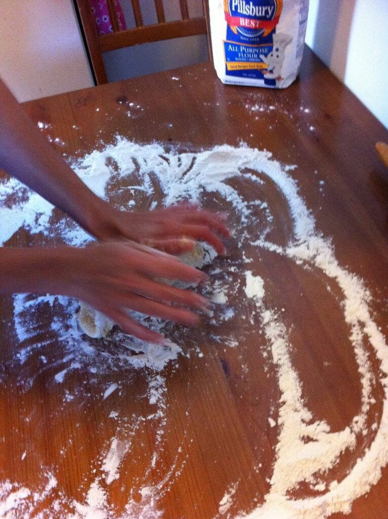 spread flour on the table to roll out haluski noodles