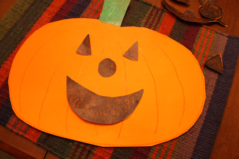 Paper pumpkin with a happy face