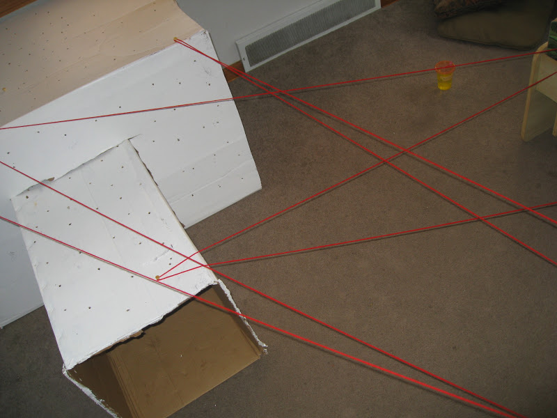 Make a spider web obstacle course by stringing thread around the living room.