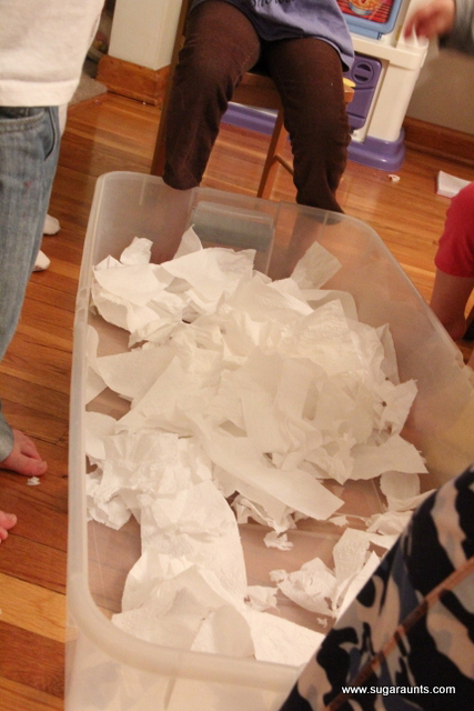 How to make fake snow using toilet paper for a fun sensory challenge to the hands.