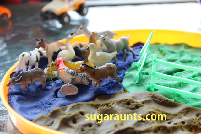 Farm animals in play dough in a play dough small world
