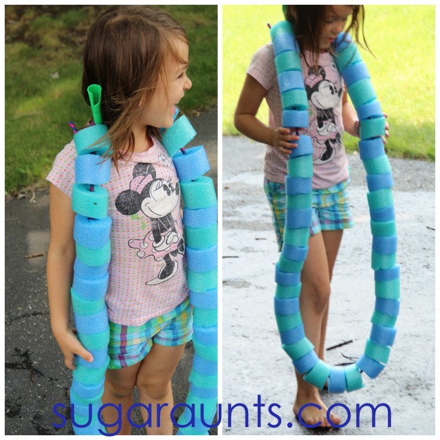Child wearing a pool noodle necklace made from pool noodle slices and a jump rope