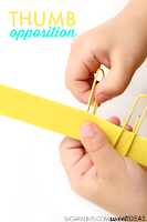 Work on fine motor skills with paperclips to improve thumb opposition.