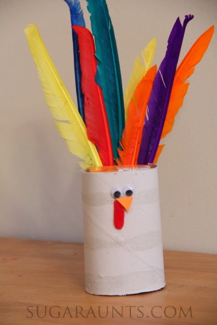 Cute cardboard turkey craft, a Thanksgiving Turkey Juicebox Cover for kids.