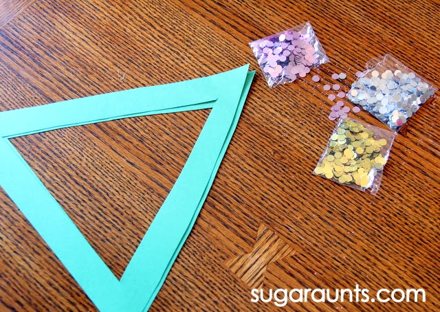 Kids can make this Christmas suncatcher craft with paper and sequins.