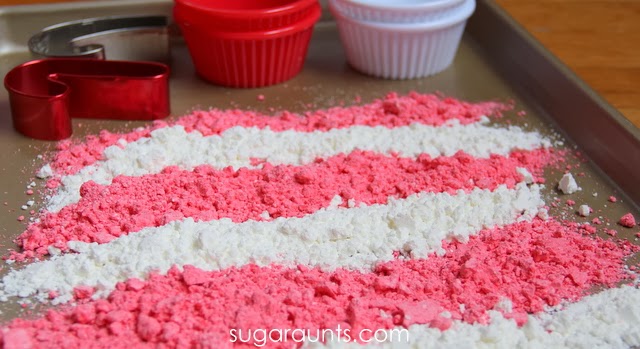 Moon dough recipe that kids can make for a Christmas sensory activity. Make this candy cane scented sensory dough with kids.