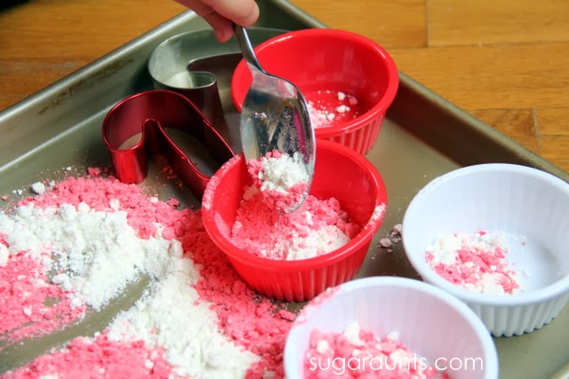 Moon dough activity for kids to scoop and pour for a holiday sensory activity.