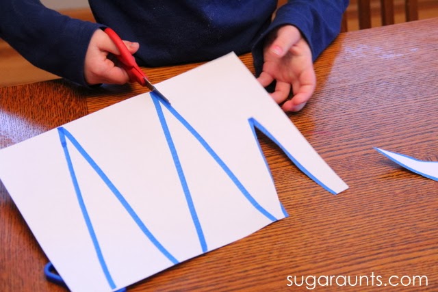 Work on preschool scissor skills using aa paper icicle craft.