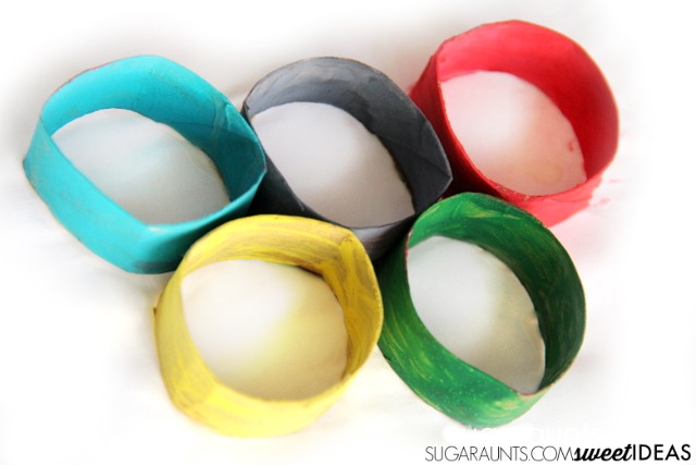 Kids will love to make these Olympic Rings craft while watching the Olympic Summer Games this year! Perfect for the winter games, too! Uses recycled toilet paper tubes for a 3D craft.