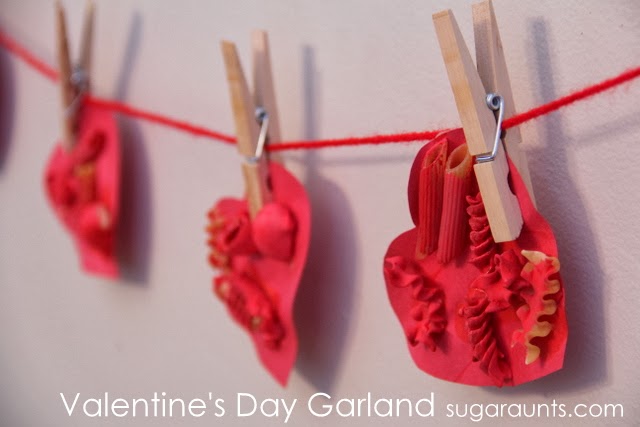 Create a Valentine's Day heart garland for decoration and fine motor/sensory experience. 