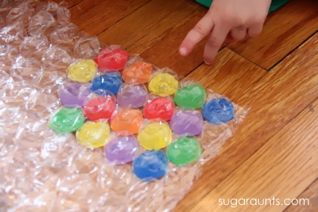 Kids will love to play "Twister" in this fine motor exercise.
