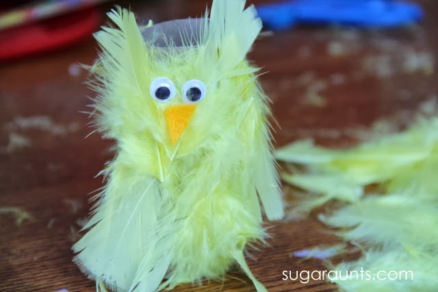 Create a peep juice box cover with feathers and a recycled paper tube.