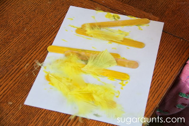 Use Feathers, paint, and glue to make a chick puppet craft.