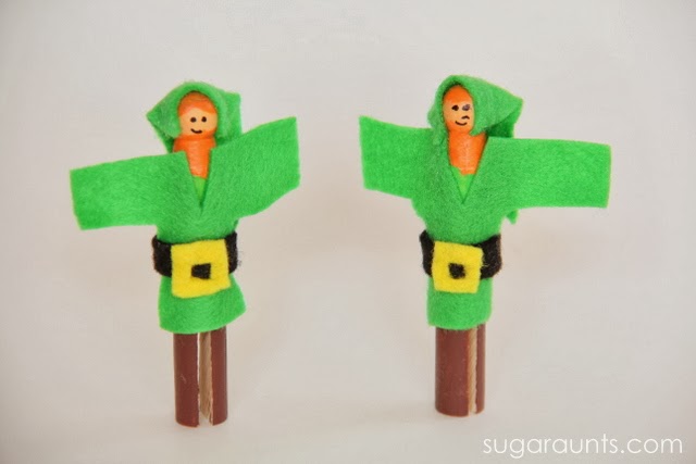 Small world pretend play for St. Patrick's Day with leprechaun peg dolls.