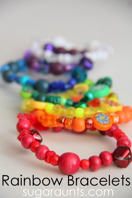 Fine motor craft with beads and pipe cleaners to make these rainbow bracelets.