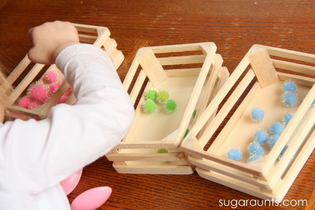 Kids can sort pom poms using tongs for fine motor play