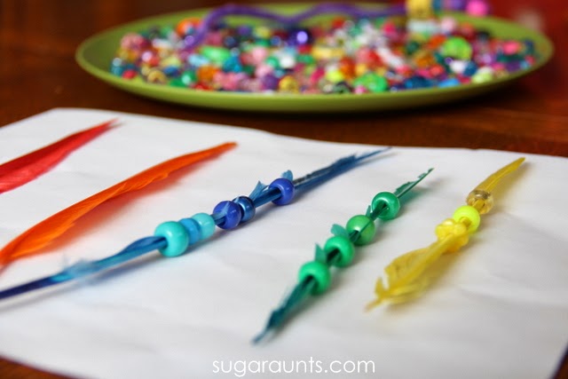 Beads and feathers are a fun way to practice colors and fine motor skills with kids.