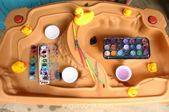 Paint rubber ducks on the water table
