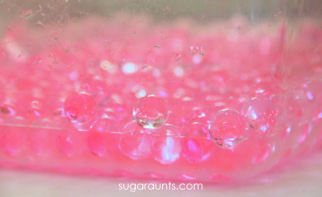 Pink water beads for sensory play.