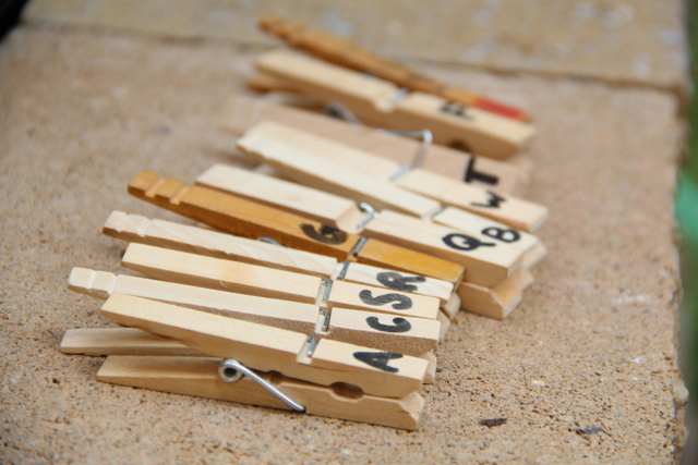 Use clothes pins for a pre-reading activity. This is great for indoors or outdoors.