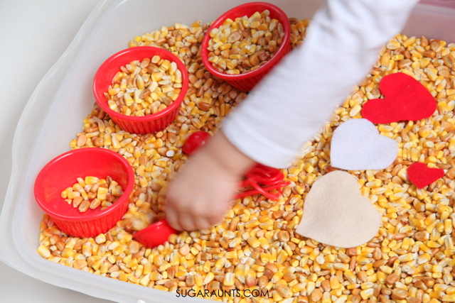 Make a Valentines fine motor sensory bin using materials in your home