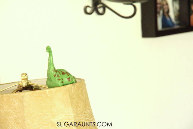 Hide dinosaur figurines and use them in the dinosaur game for preschoolers and toddlers to develop motor skills.