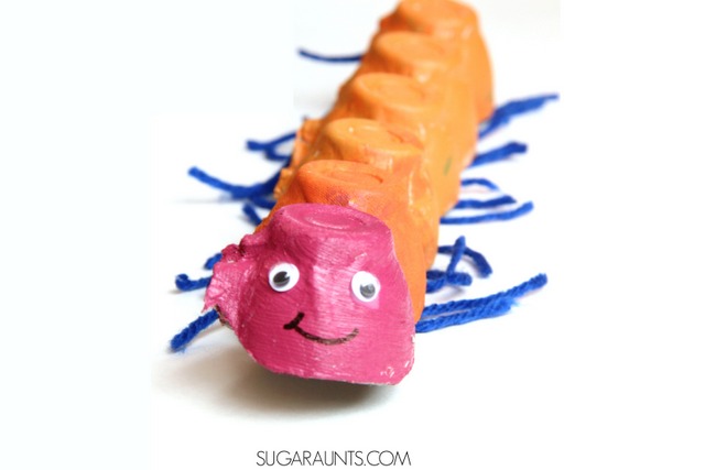 Love bug caterpillar craft made from a painted egg carton with string legs to help kids develop fine motor skills.