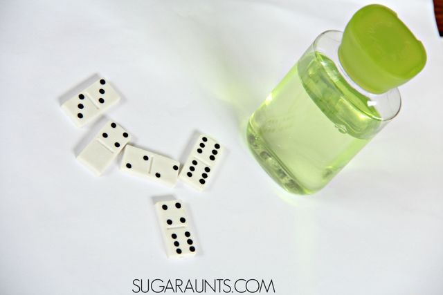 Make a math inspired dominoes sensory or discovery bottle with light! this is perfect for Kindergarten and First grade math.