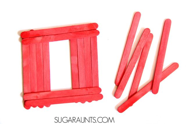 Barn craft with red popsicle sticks