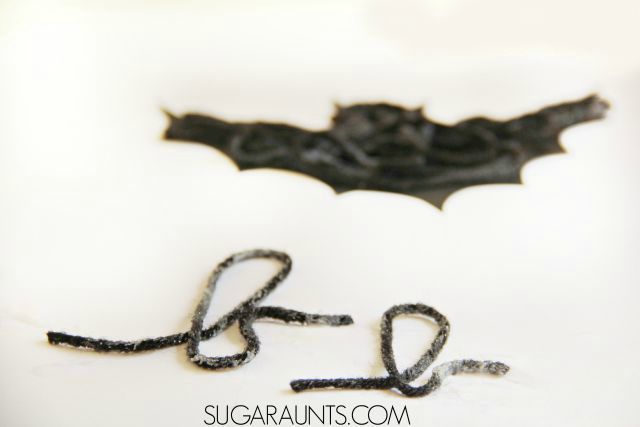 Halloween textured bat craft and creative letter formation activity in this sensory Halloween craft that is a Scissor Skill power house.  Appropriate and fun for creative kids from preschool, kindergarten, and elementary school aged.