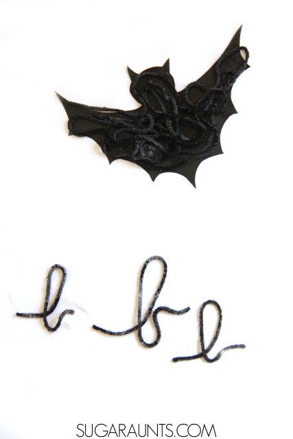 Bat template and letters made with black yarn.