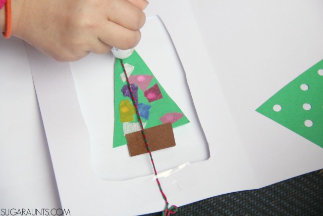 Kids can make this 3D Christmas Tree card while working on so many fine motor skills like hand strength, open thumb web space, intrinsic muscle strength, arch development, with proprioceptive input, too.  The Occupational Therapist in me loves this!
