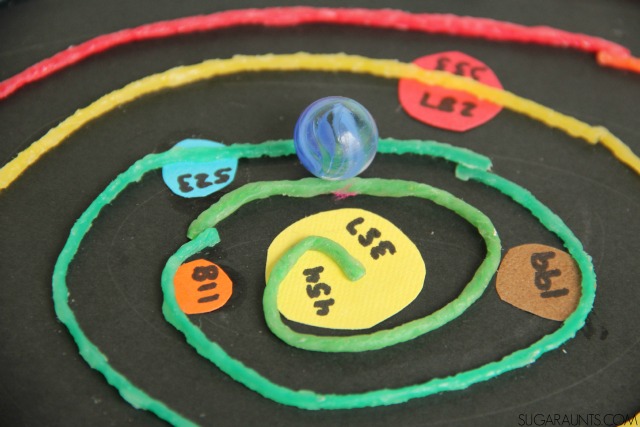 Practice regrouping three digit numbers with this 3D Outer Space math maze that kids can use for extra practice and with bilateral hand coordination.