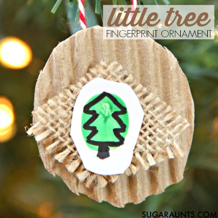 Little fingerprint Christmas tree ornament memento based on the book, little tree by e.e. cummings.  This kid-made Christmas ornament is a fine motor workout for intrinsic muscle strength, arch development, and finger isolation.