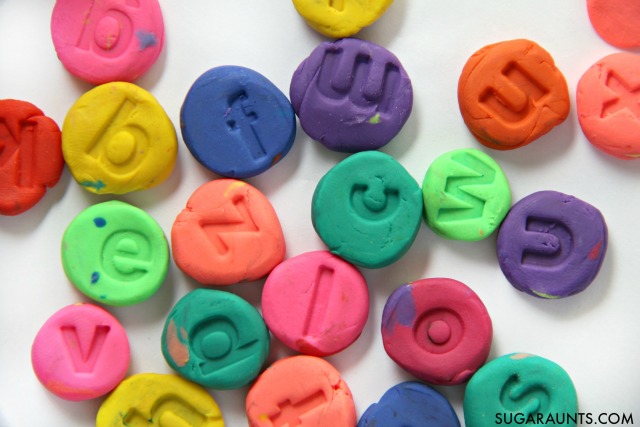 Make clay letters with alphabet stamps and use them in spelling words, decodable reading, word building, letter identification, and alphabetical order activities for multi- age learning ideas and hands-on learning in this fine motor work learning and play idea for kids. 