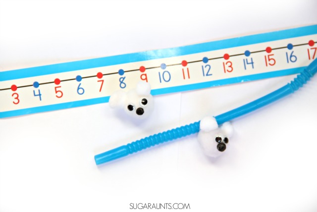 Make a polar bear craft with craft pom poms and use it in a polar bear game in therapy interventions or the classroom.