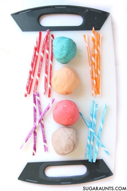 This sensory play dough recipe is so cool! Its made with Pixy Stix candy and smells amazing.  The best part is freezing the dough-its such a great fine motor strengthening activity and great for proprioceptive input to the hands.