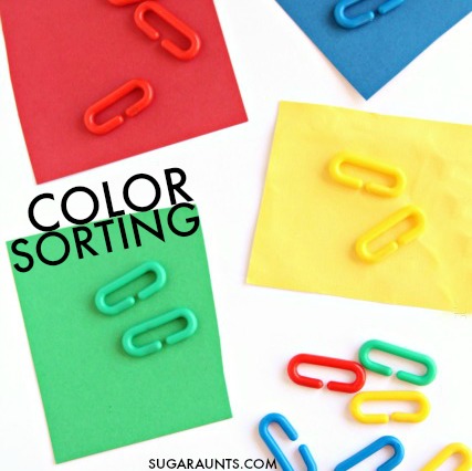 Color sorting activity for toddlers using rainbow plastic chain links for learning and fine motor skills. This is an Occupational Therapists recommended tool for so many skills: bilateral hand coordination, tripod grasp, intrinsic hand strength, open thumb web space, extended wrist, and so many more.