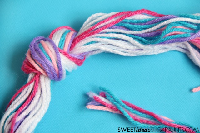 Kids can cut yarn in crafts to work on scissor skills.