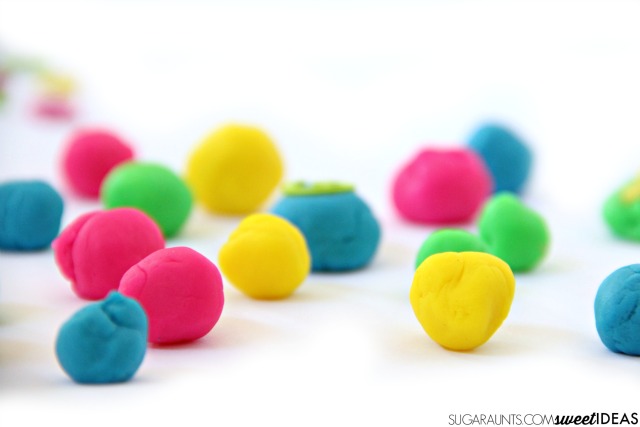 Use balls of play dough with letter manipulatives
