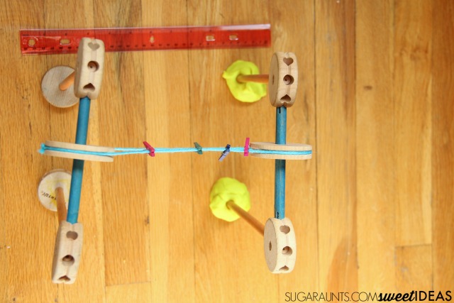 Build a Tinker Toys Pulley system and explore STEM concepts in learning with kids.