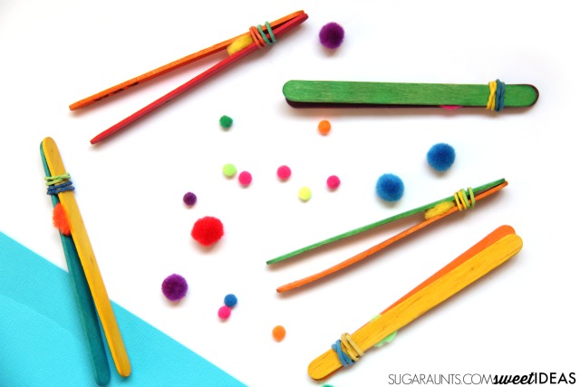 Build fine motor skills including pencil grasp using these homemade DIY tweezers made from craft sticks.