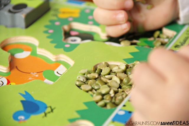 Work on fine motor skills like in-hand manipulation with a wooden letter puzzle.  You can do this with any puzzle and work on things like letter identification, letter formation, numbers, animals, or shapes. Perfect for preschool or toddler activities.