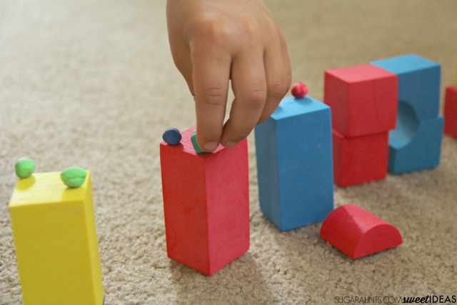 Help kids build their fine motor skills especially precision of grasp and release with this foam block and clay math engineering activity that addresses shapes and vertices.