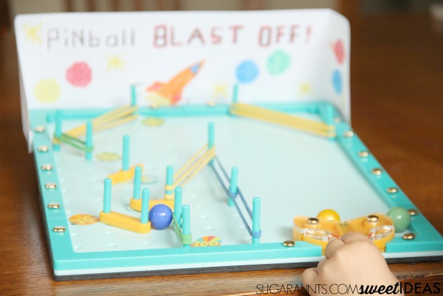 Build fine motor skills with a DIY pinball machine activity from Kiwi Crate. Kiwi Crate review for hands-on creativity, learning, and development.