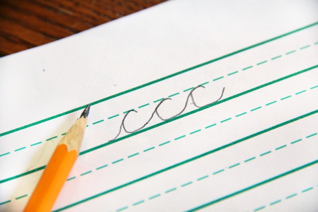 Teach cursive c by showing how the pencil traces back over the first line, or re-trace.