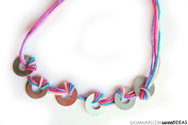 Use yarn and washers to create fun jewelry in this creative process art kids'craft. 