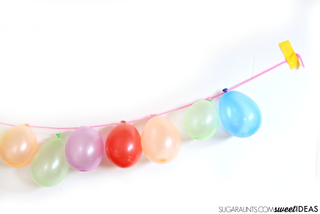 Balloon garland for parties- This would be perfect for kids' birthday parties as a photo backdrop, tablescape feature, or strung across the room.