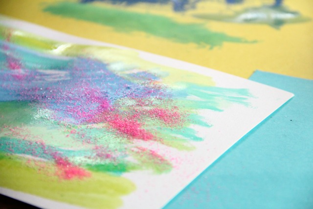 Glitter and watercolors are all you need for creative lacing cards and fine motor skills development in kids.