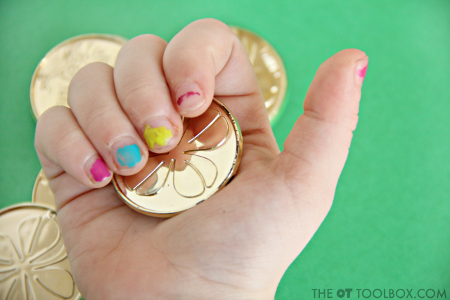 Use coins to work on fine motor skills for kids like hand strength, in-hand manipulation, translation, dexterity, precision, and more. 